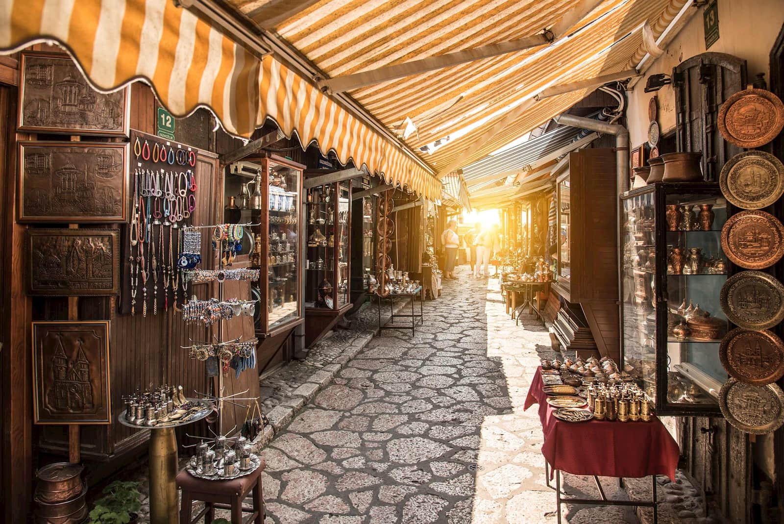 Market alley with shops and colourful awnings in Sarajevo, Bosnia and Herzegovina