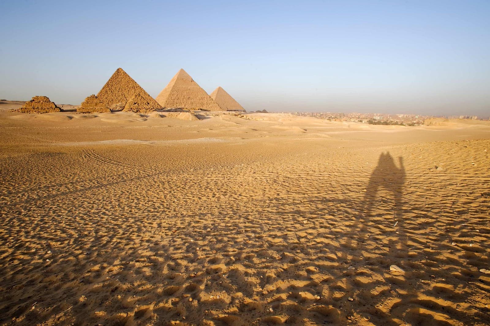 A desert view of the Pyramids of Giza