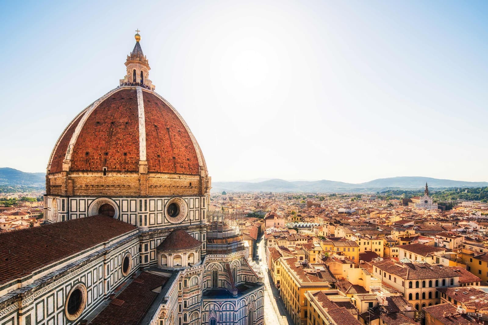 Duomo Santa Maria del Fiore dome towering over Florence city rooftops