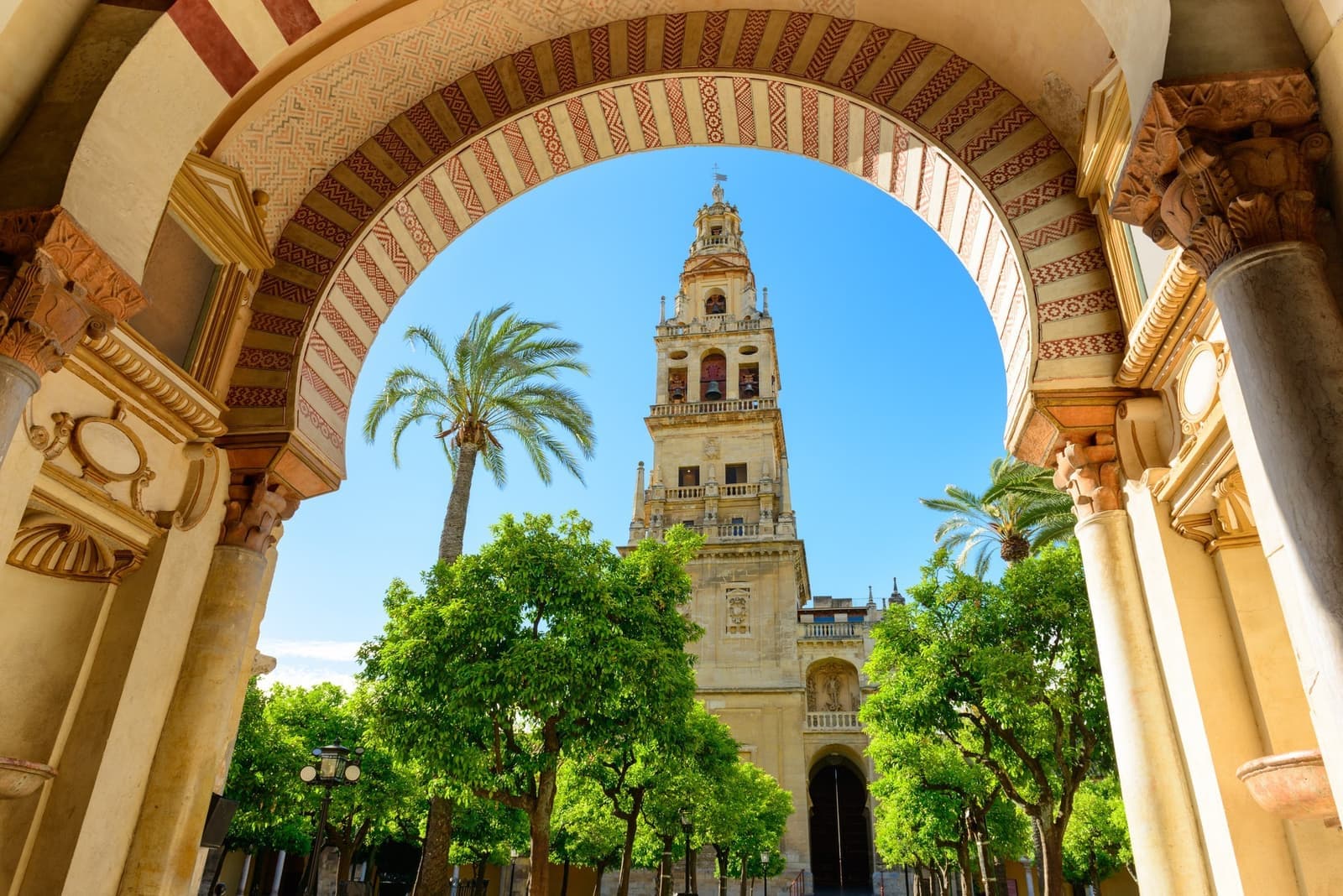An arched passageway looking at the Córdoba Mosque Cathedral