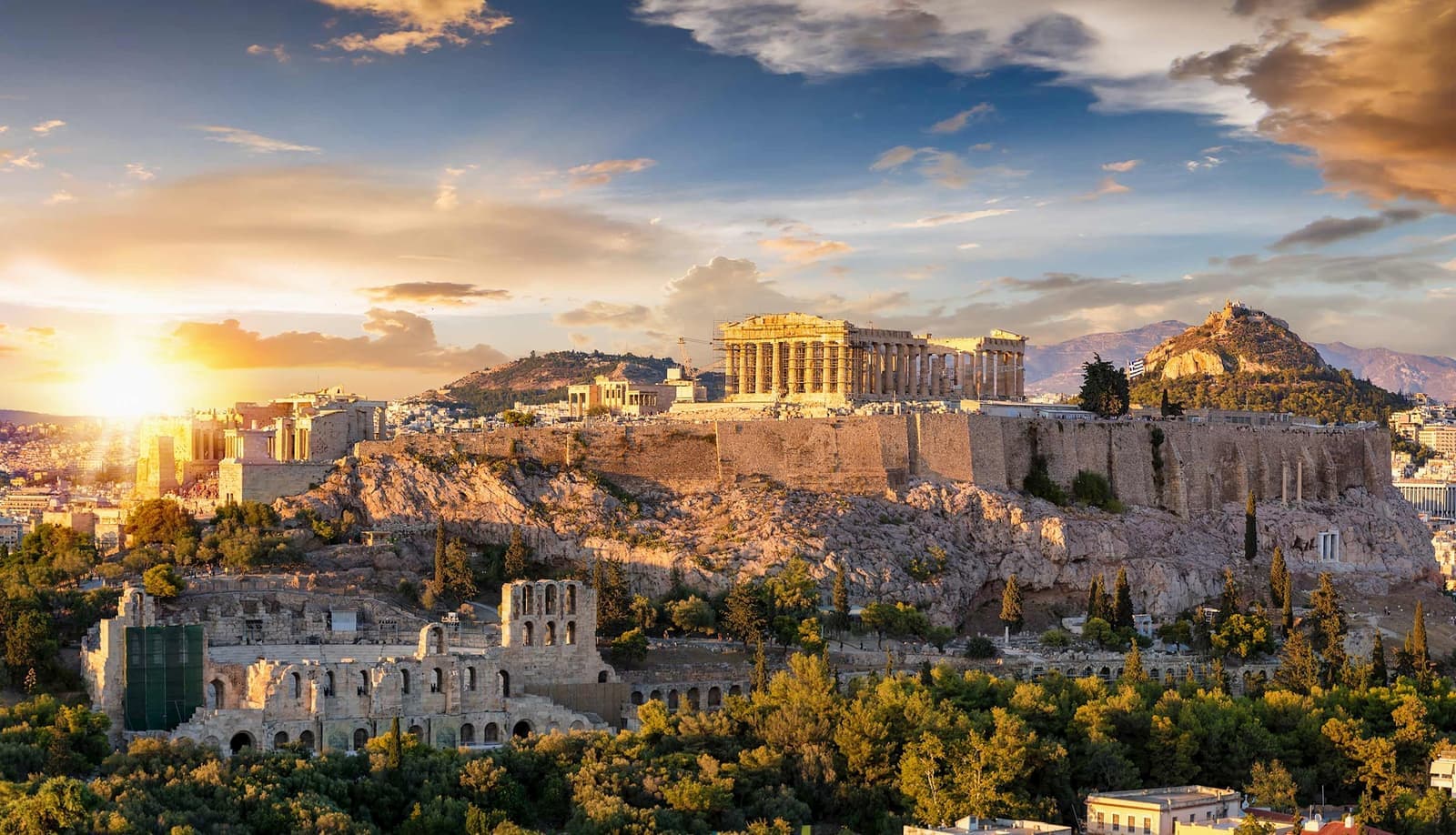 The sun rising over a scenic view of the city of Athens, Greece