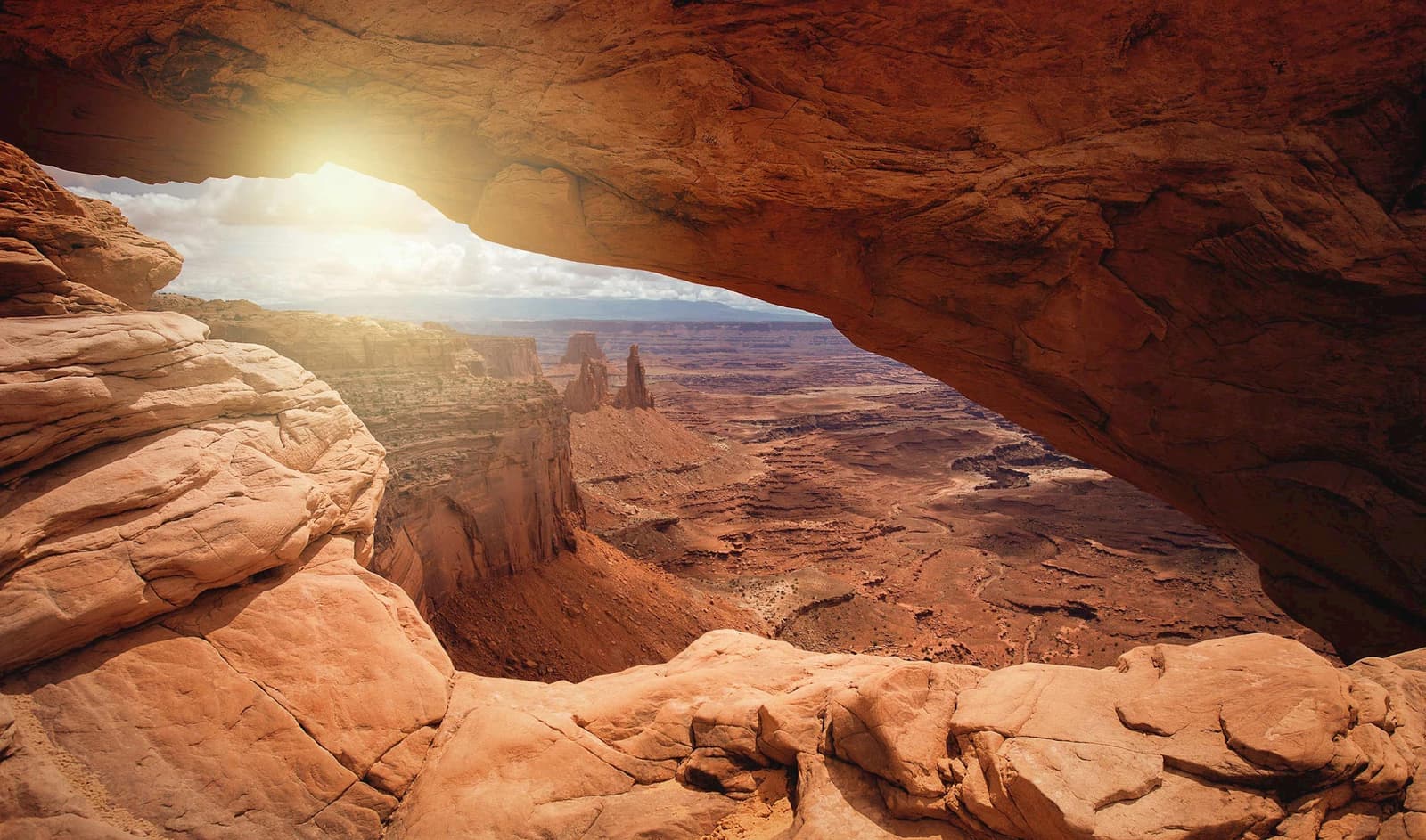 View of Canyonland National Park through the Mesa Arch, Utah, USA