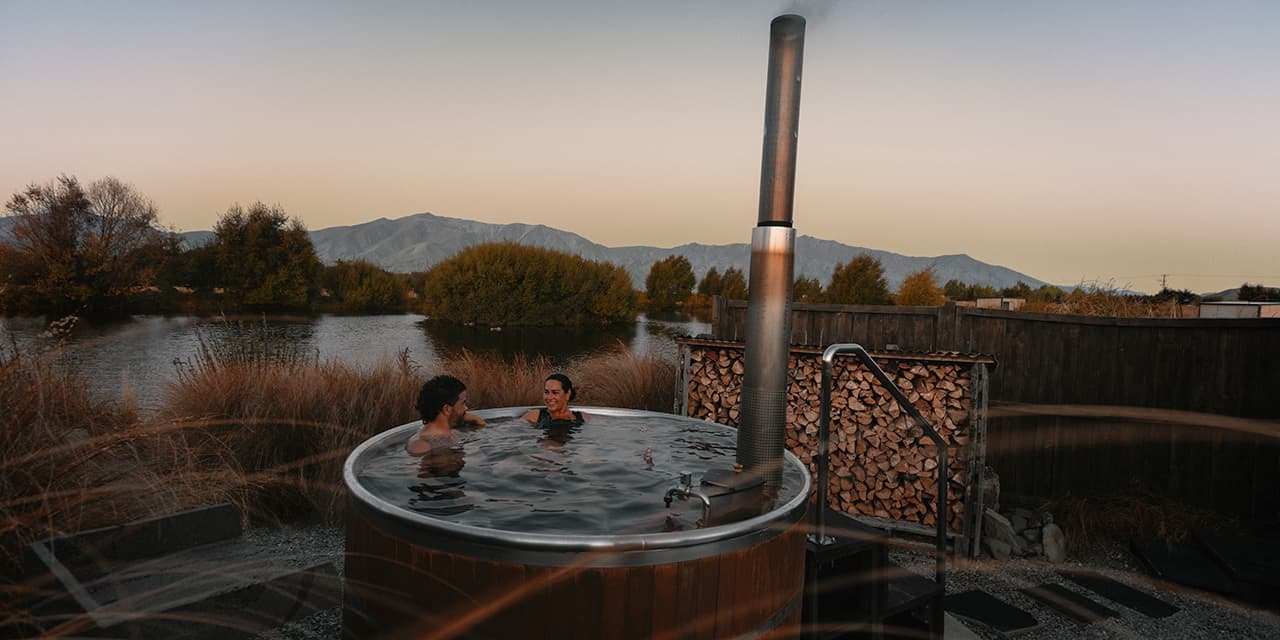 People Relaxing In Spa Bath