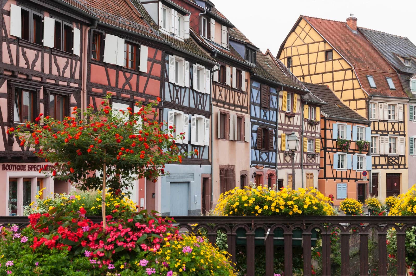 Petit Venise with half-timbered houses and flower-lined railings in Colmar, France