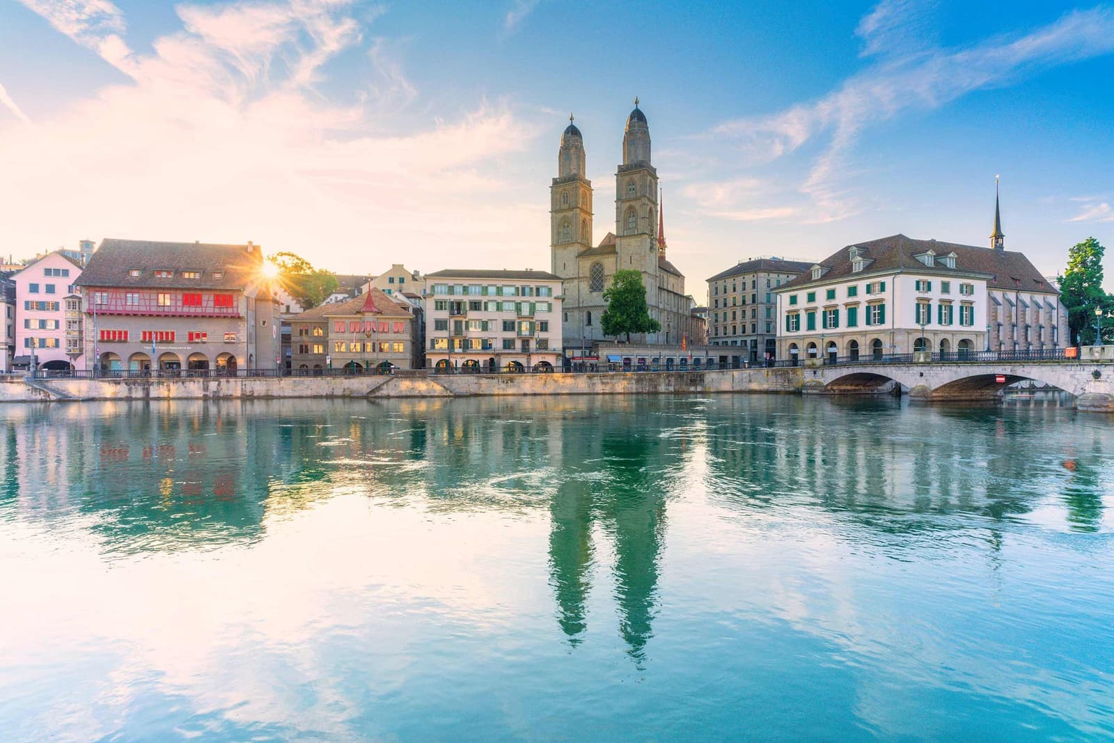 The sun peaking through the city of Zurich, Switzerland
