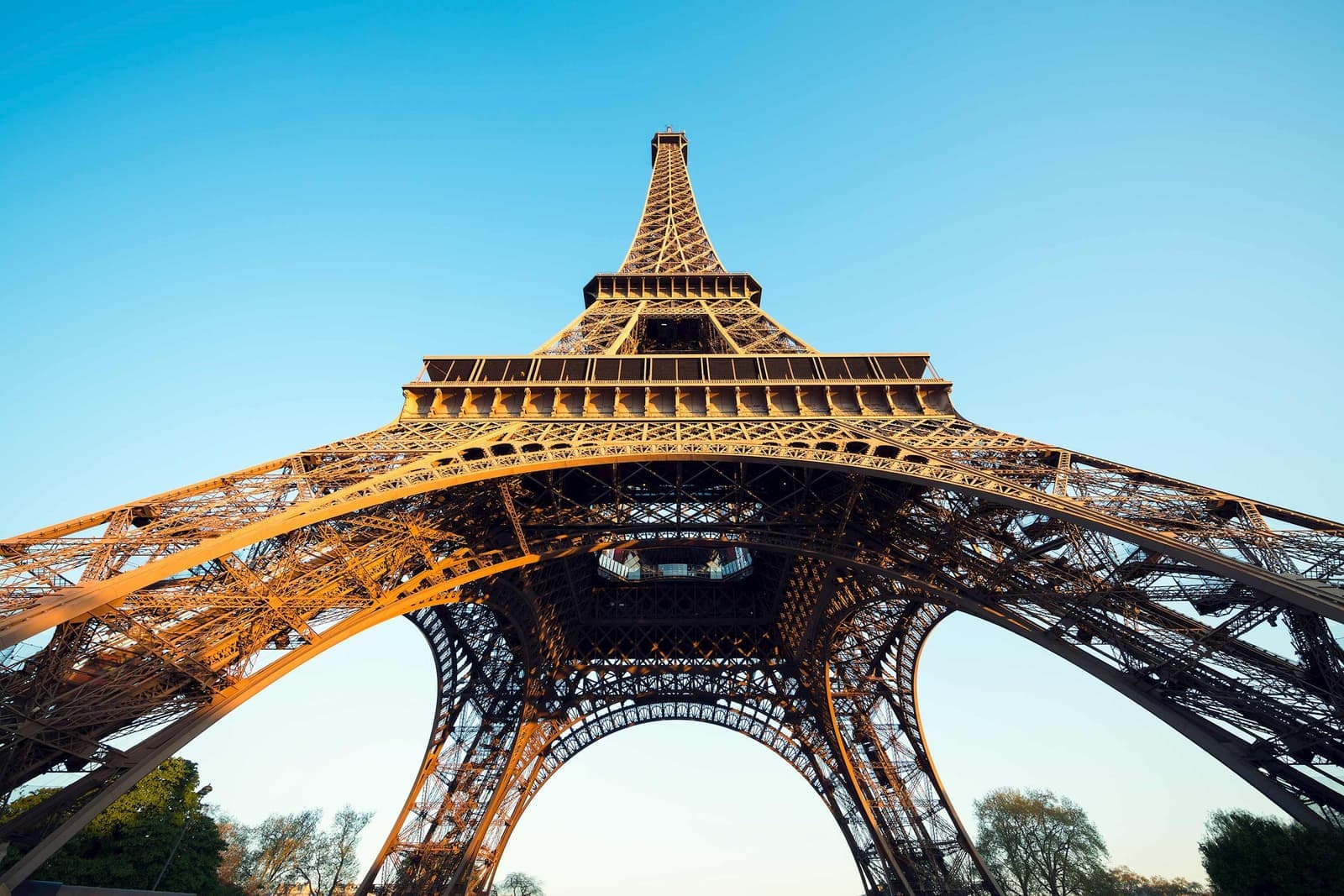 Eiffel Tower from below with clear blue sky in Paris, France