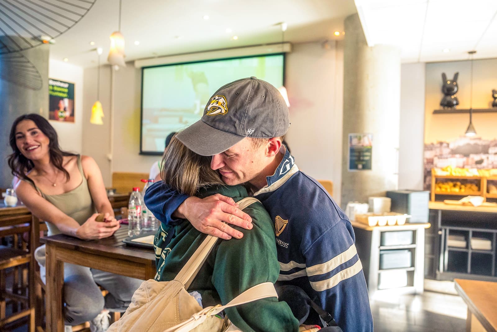 Travellers hugging to say goodbye