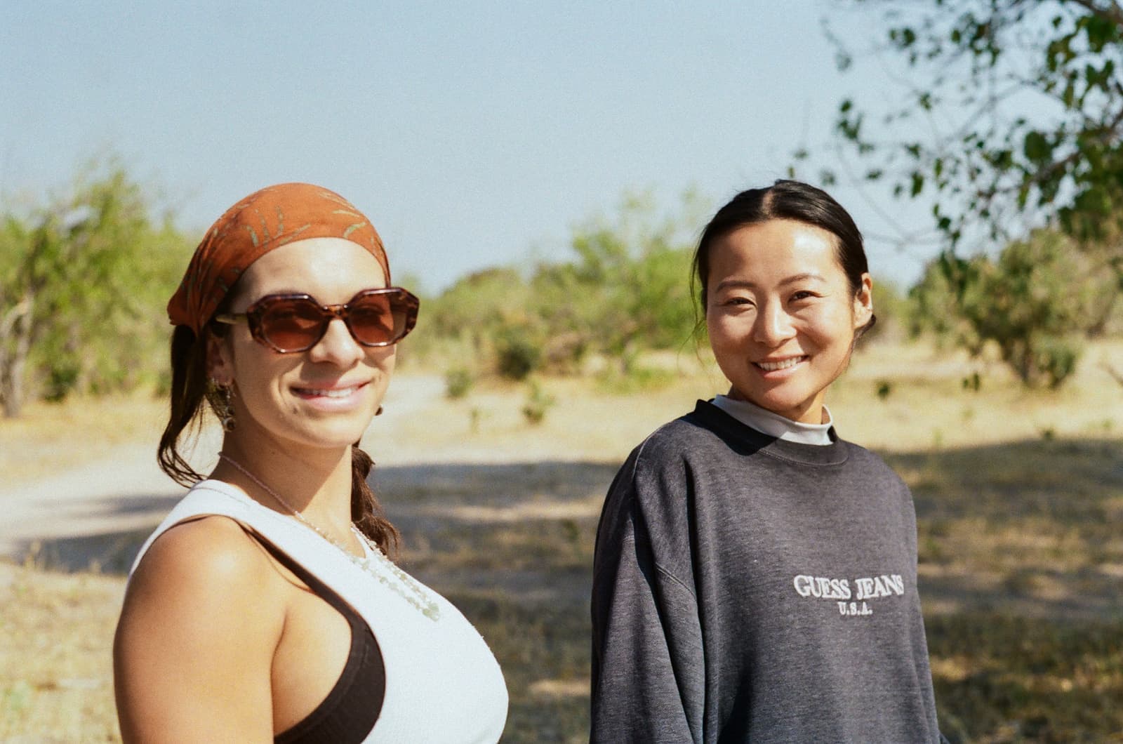 Two travellers smiling at the camera in Maun, Botswana