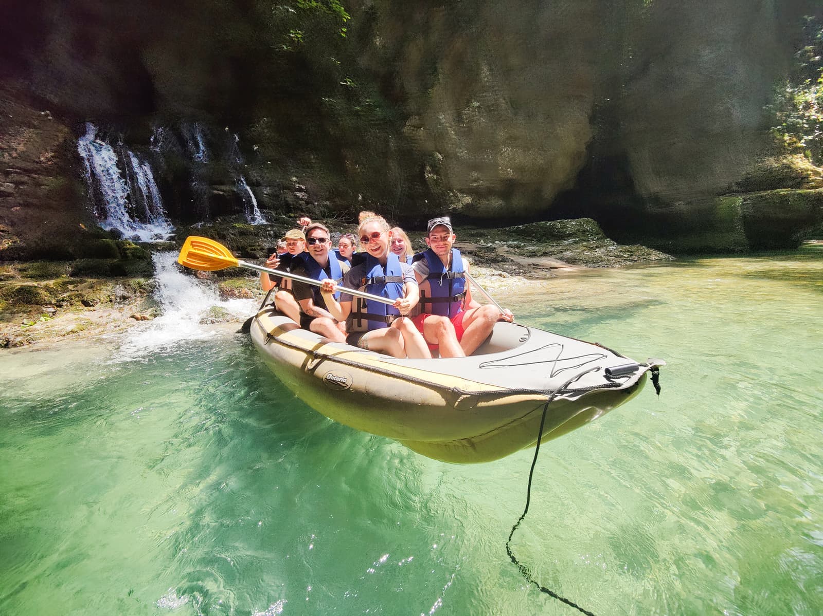 Travellers gliding around the Martvili Canyon in a raft, Georgia