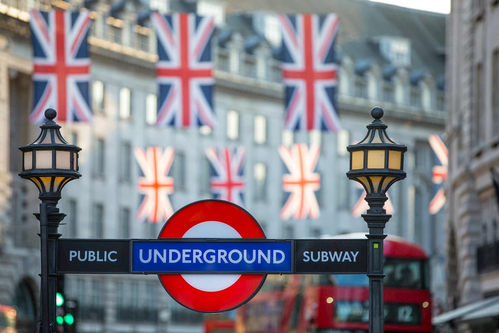Flags hanging over streets and public sign in London, England