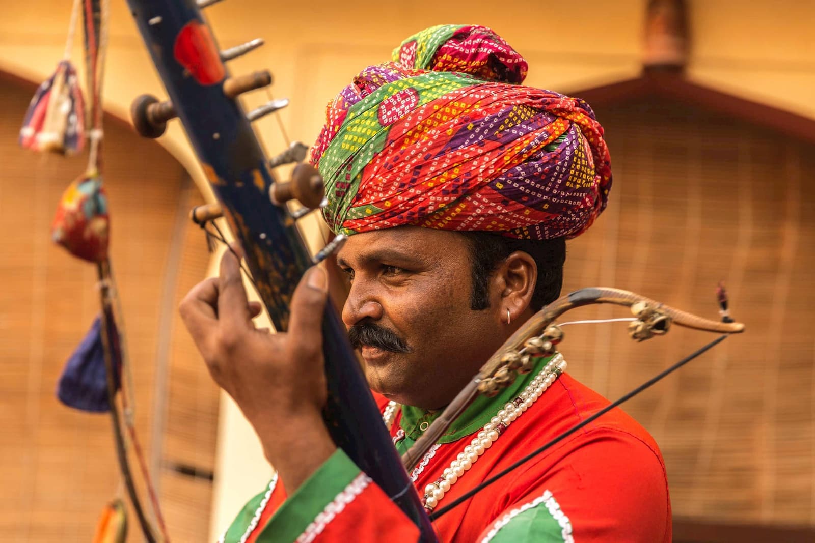 Traditional Rajasthan musician playing string instrument