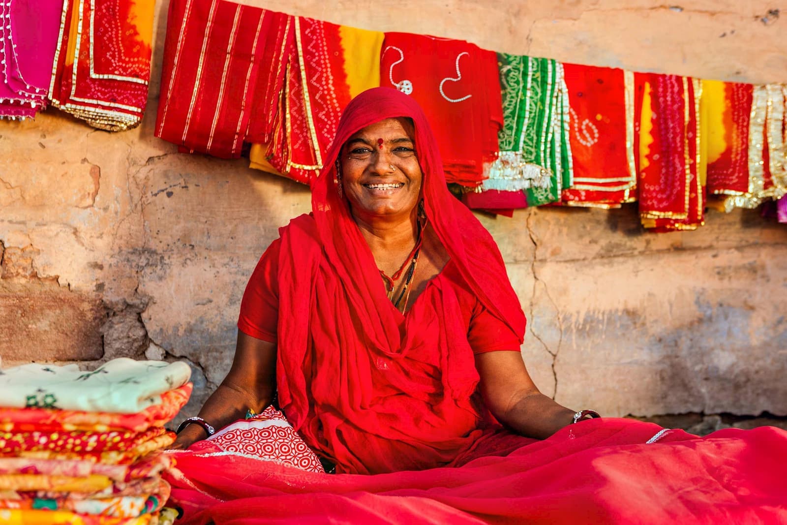 Vendor smiling at local market in Udaipur, India