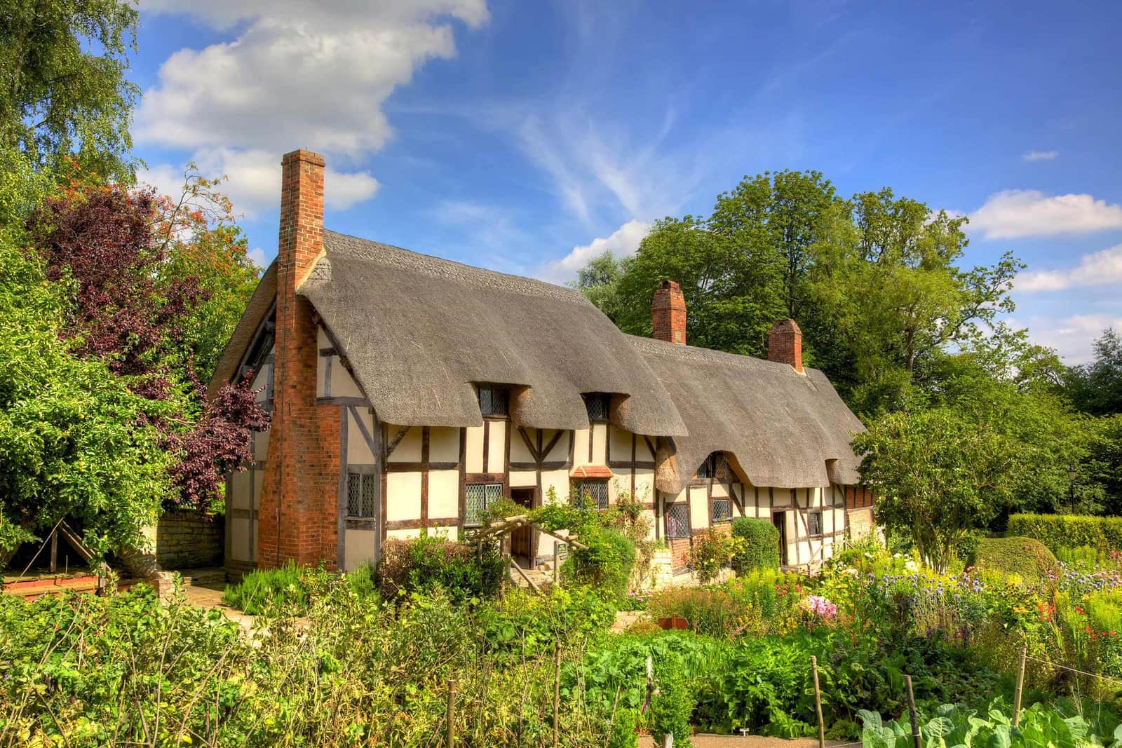 A scenic view of Anne Hathaway's Cottage in Stratford-upon-Avon, England