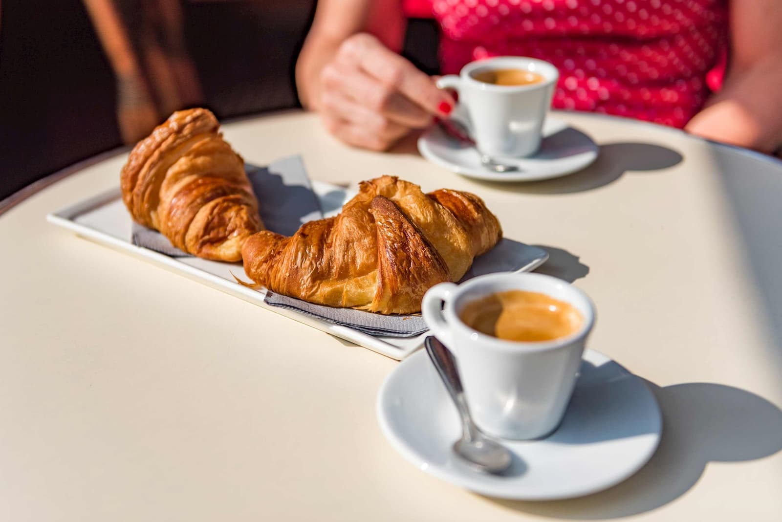 A Parisian breakfast with croissants and espressos