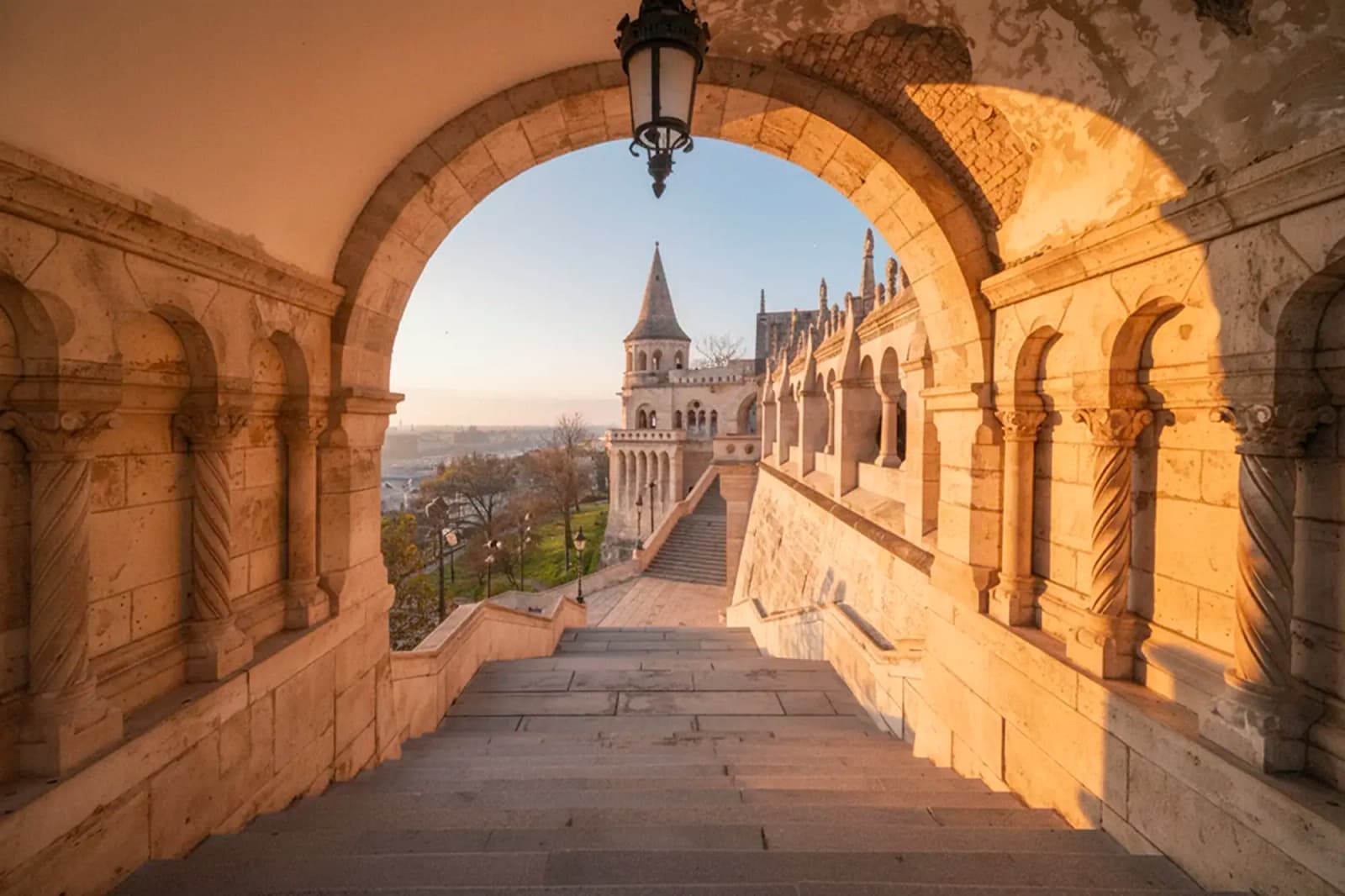 Fisherman’s Bastion in Budapest, Hungary, viewed through a stone archway.