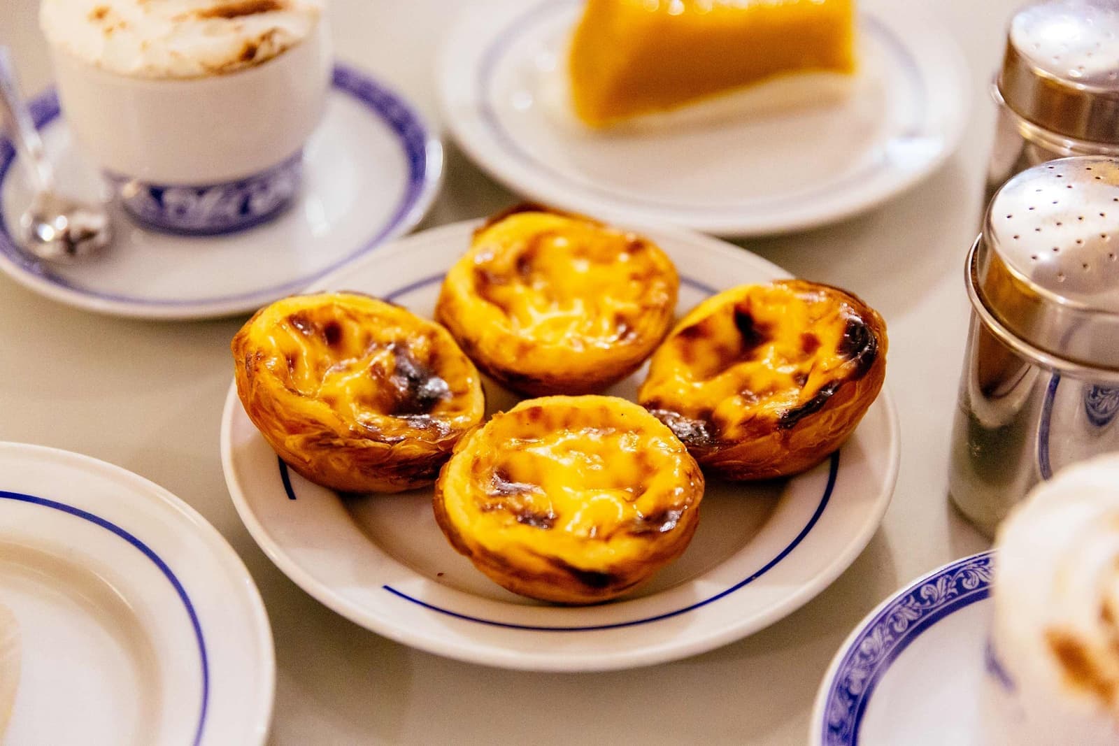 Plate of pastry served with coffee in Lisbon, Portugal