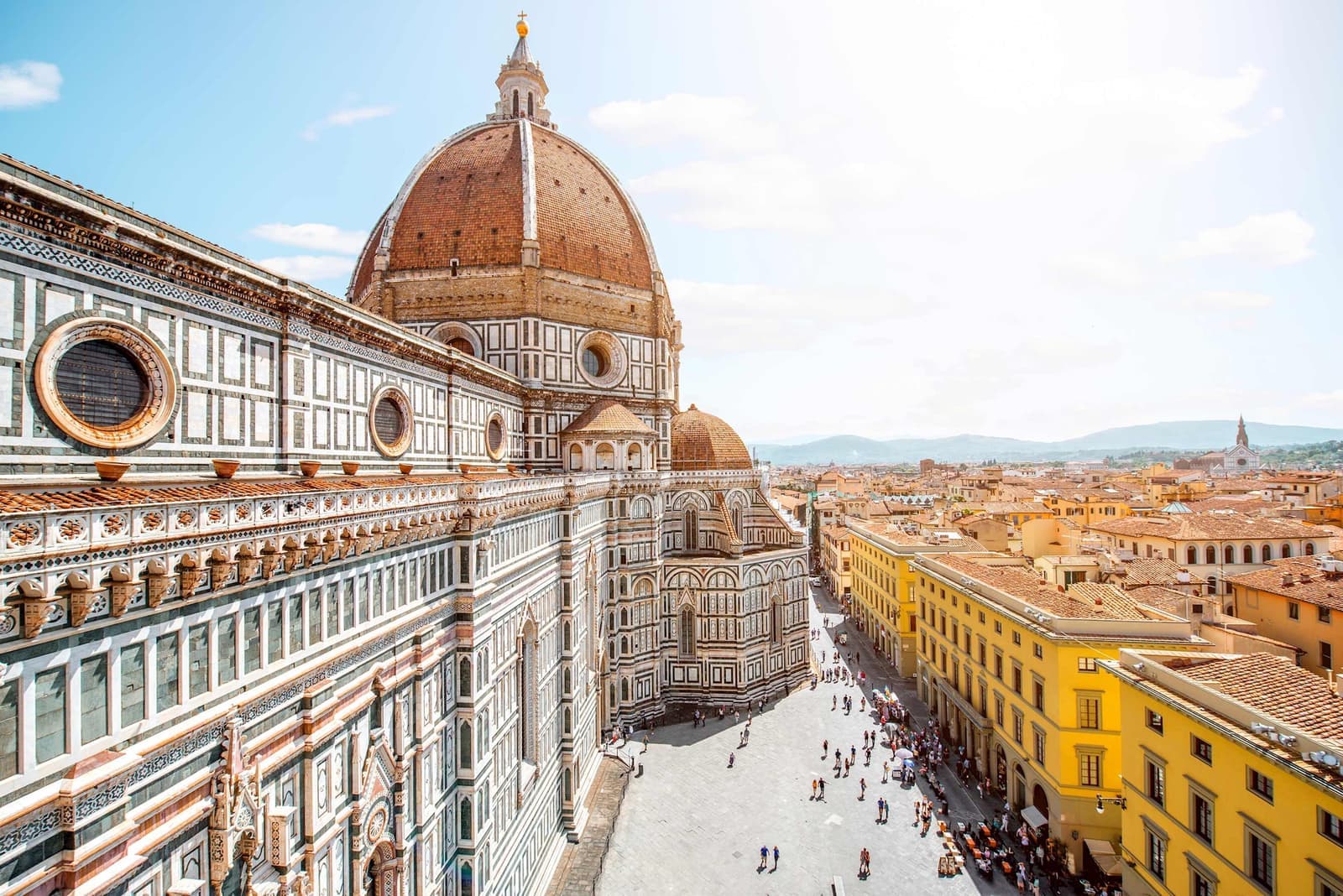 A view of Duomo Santa Maria Del Fiore and people in the distance in Florence, Italy