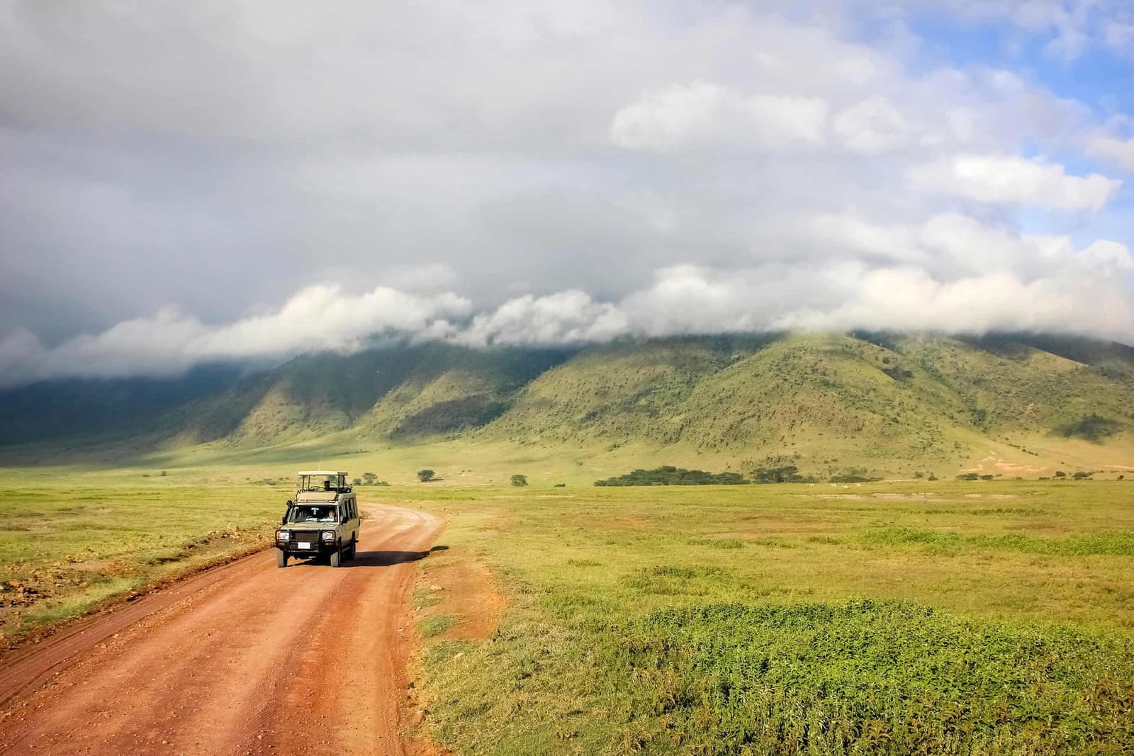 A safari van driving through the Ngorongoro Crater in Tanzania