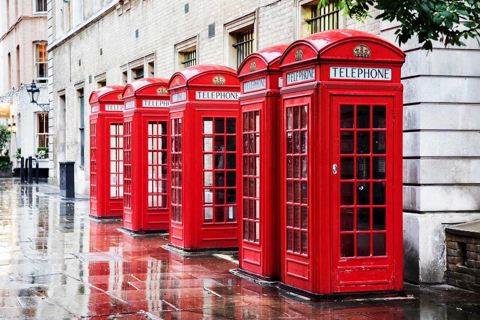 Row of Iconic Red Telephone Boxes in London, England