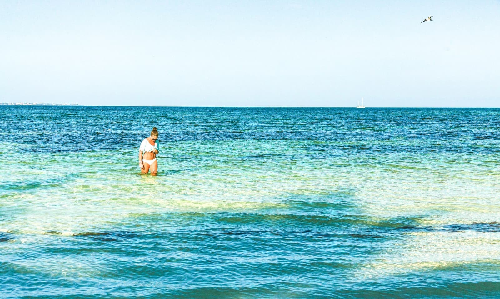 Traveller in the sea at Cancun in Mexico