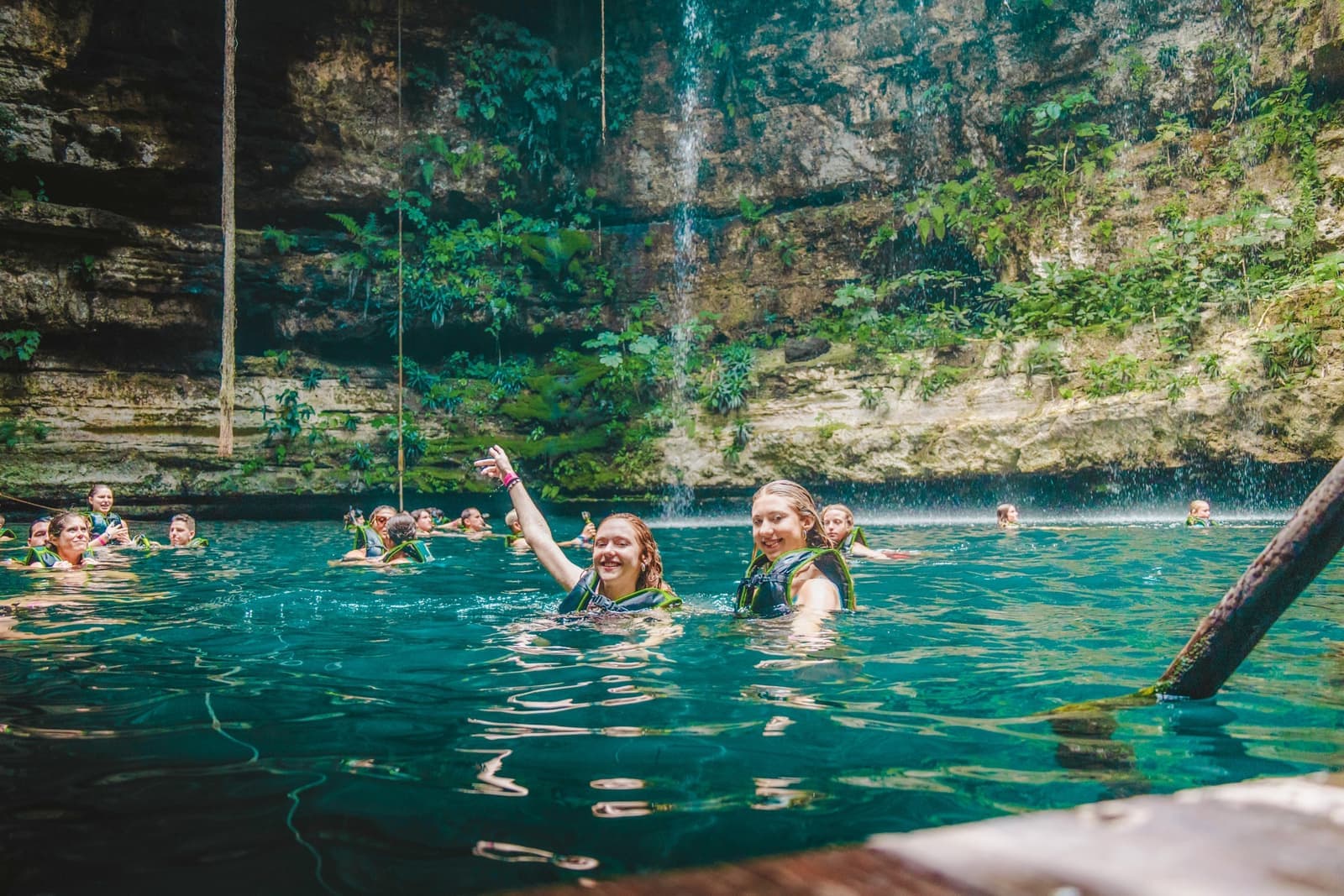 Travellers Swimming in Cenote in Life Jackets, Chichen Itza, Mexico