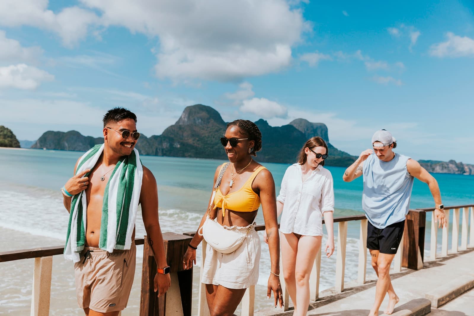 Travellers Walking along Jetty from Sea to Beach, El Nido, Philippines