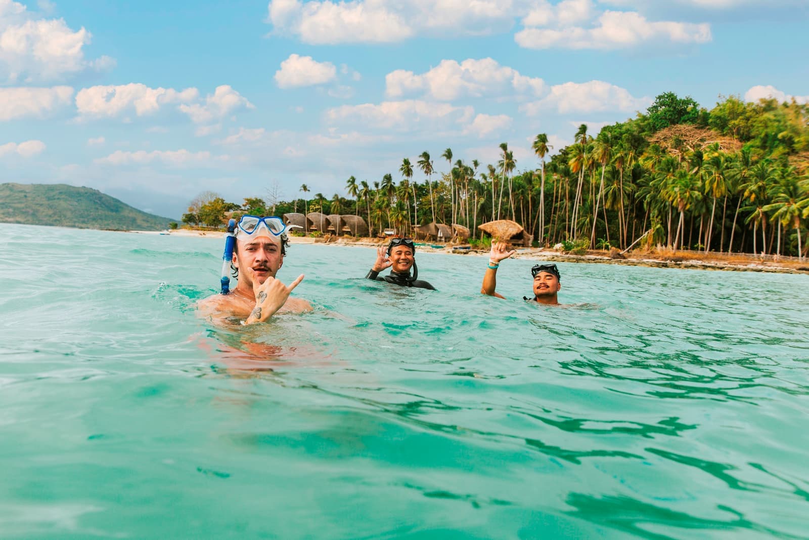 Travellers Swimming with Snorkelling Gear on in the Bay by Island Special Stay, Darocotan Island, Philippines