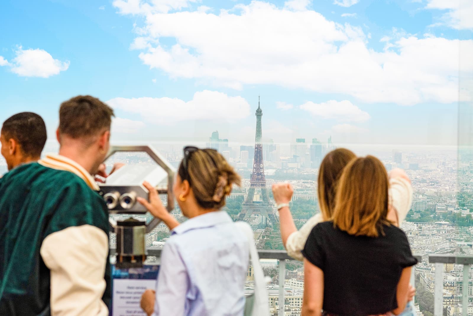 Travellers viewing the Eiffel Tower from Montparnasse Observation Deck, Paris, France