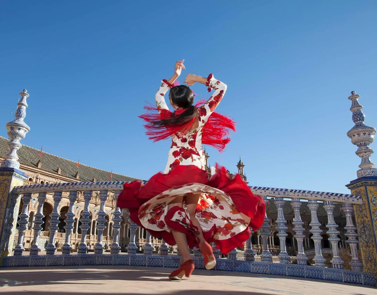A flamenco dancer on a bridge in Seville, Spain