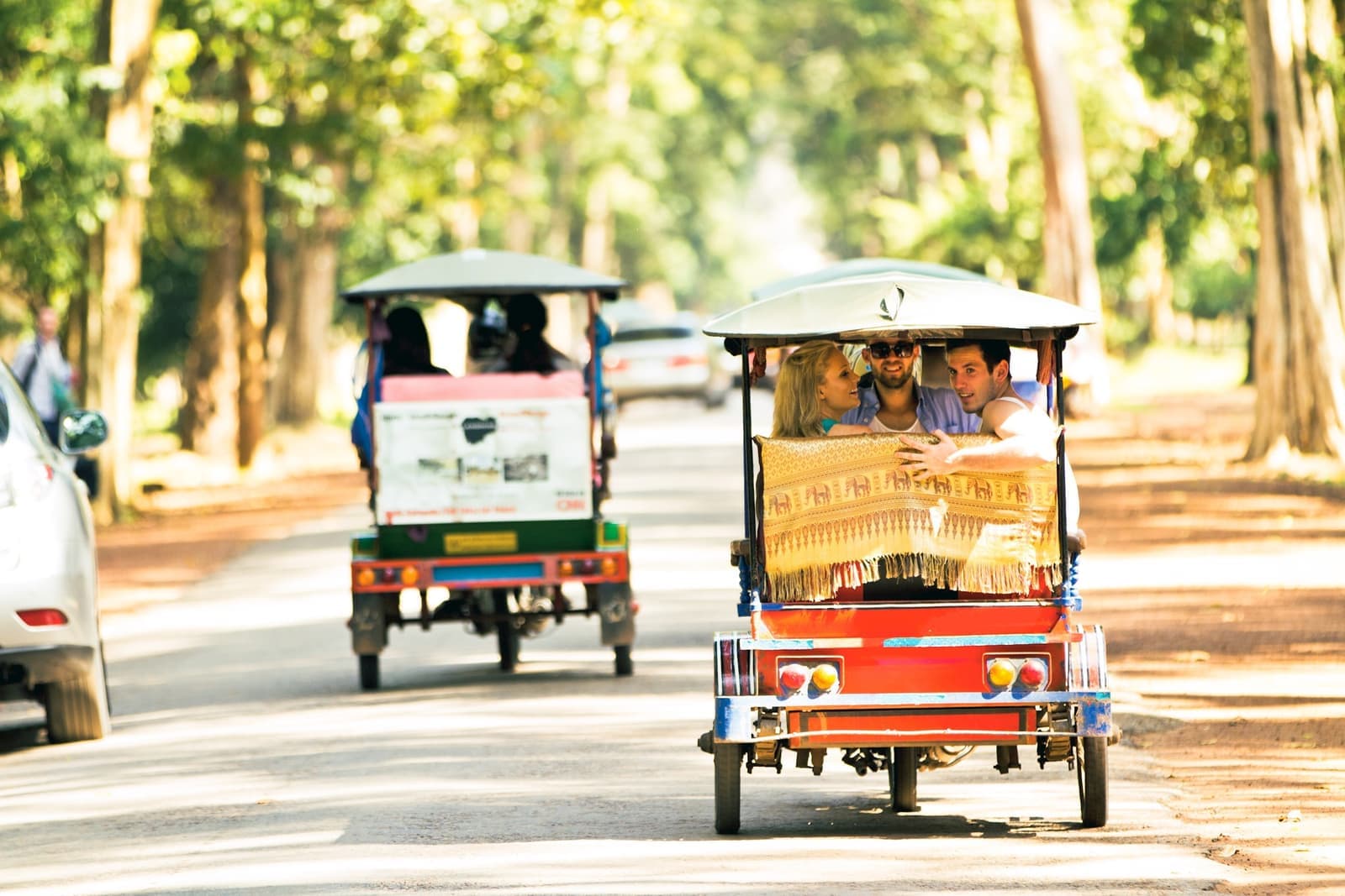 Travellers on tuk tuk transport in Siem Reap, Cambodia