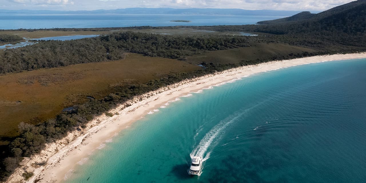 Boat Cruising On Wineglass Bay