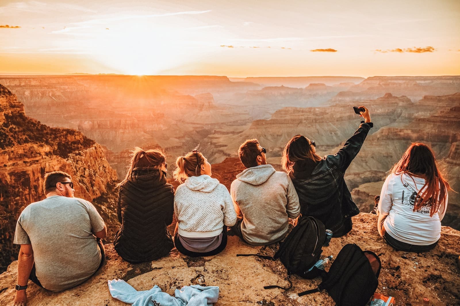 Travellers taking a sunset selfie at the Grand Canyon, USA