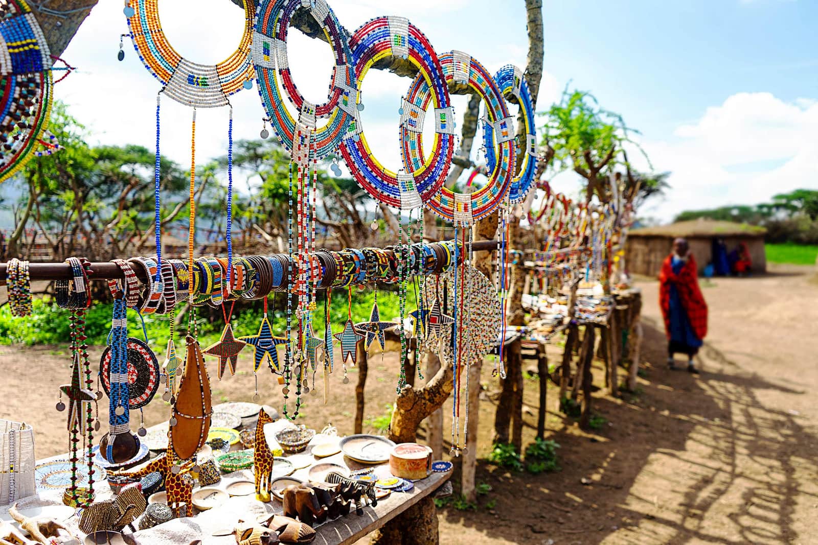 Traditional jewellery and colourful souvenirs displayed at a stall, Maasai Mara, Kenya