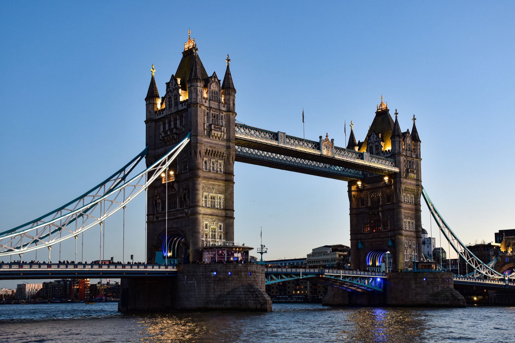 Tower Bridge lit up at twilight in London, near Cunard's home port of Southampton